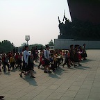 putting down flowers in front of Kim Il Songs monument 2