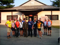 the group from bike for peace with the officer showing us around at the DMZ (De militarized Zone)